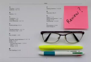 An index proof with a pair of glasses and two pens