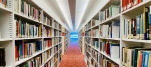Two rows of full library bookshelves
