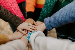 A group of hands meeting together